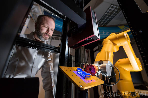 Sandia's robotic work cell conducts high-throughput testing 'in an instant'