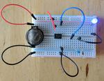 Blinking Blue- Powering a 3.7 volt LED from a 2.4 volt coin cell with a $0.02 charge pump