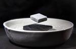 Weird Superconductor Leads Double Life