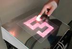 Novel tactile display using computer-controlled surface adhesion