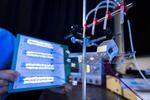 CityU new droplet-based electricity generator: A drop of water lights up 100 small LED bulbs