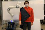 Getting dressed with help from robots