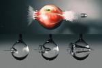 High-speed camera captures a water jet’s splashy impact as it pierces a droplet
